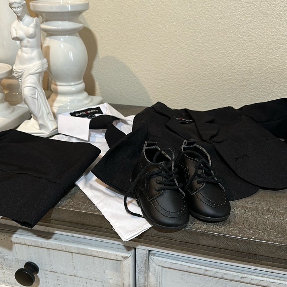 Only used once.  Baby tuxedo w shoes